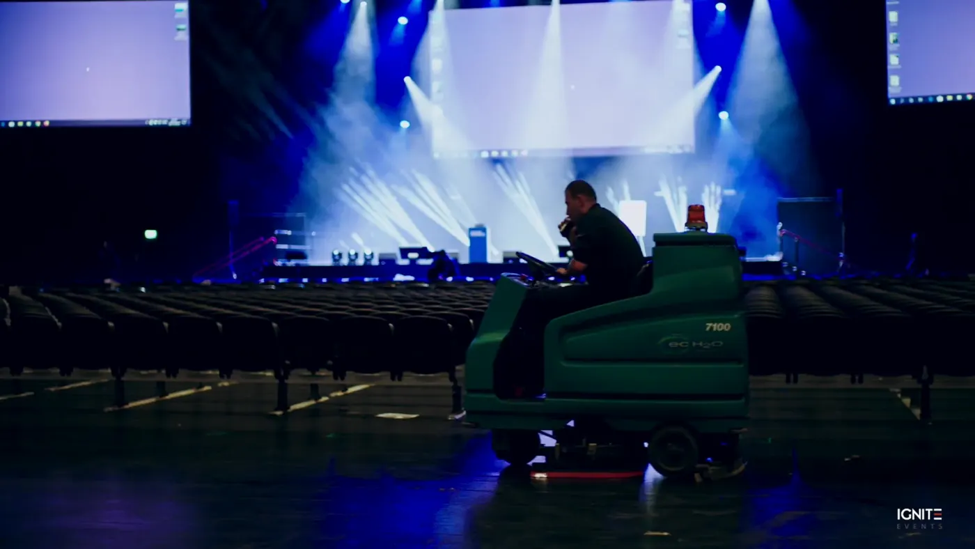 Stage with a large LED screen wall and blue lighting before doors