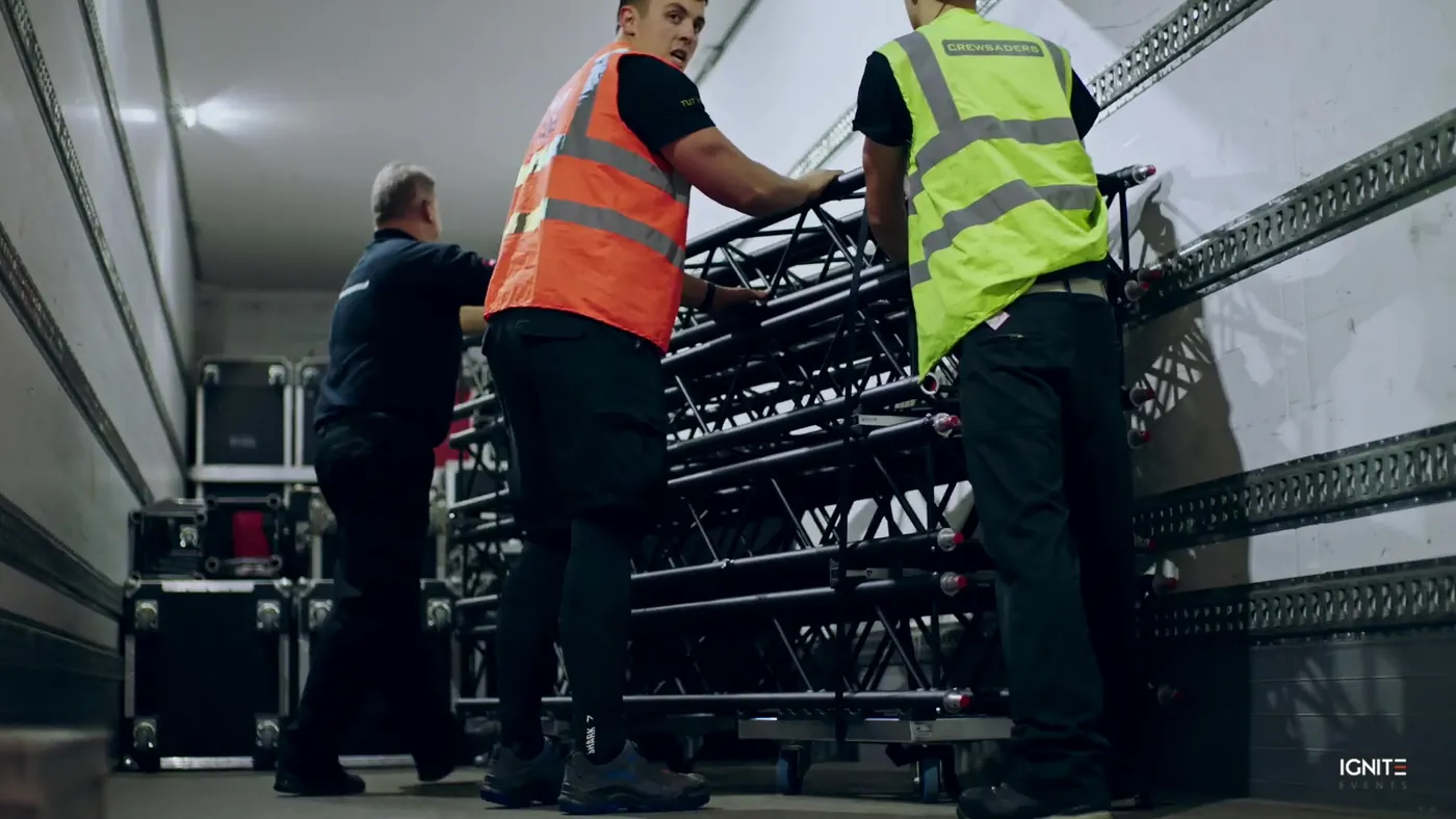 Crew loading stacked truss onto a truck